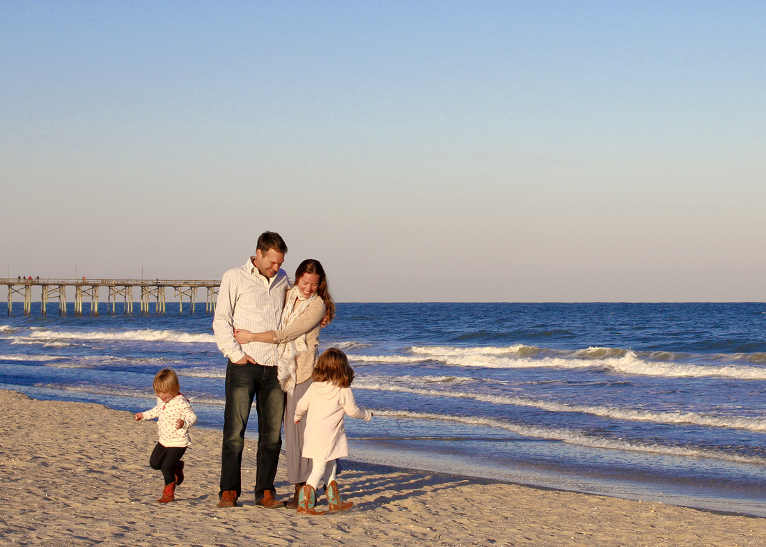 Fall portrait: Family beach photo. Girls running circles around their parents. By Calm Cradle Photo & Design