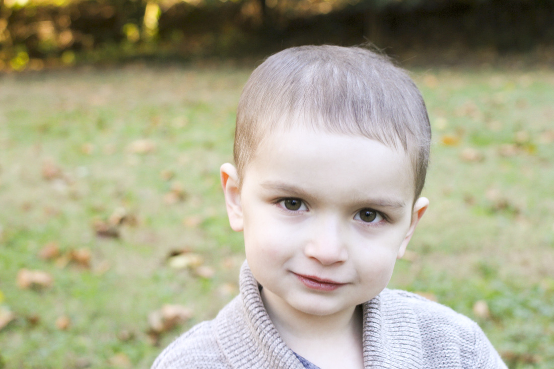 Lifestyle portrait session: Little boy with a camera. By Calm Cradle Photo & Design