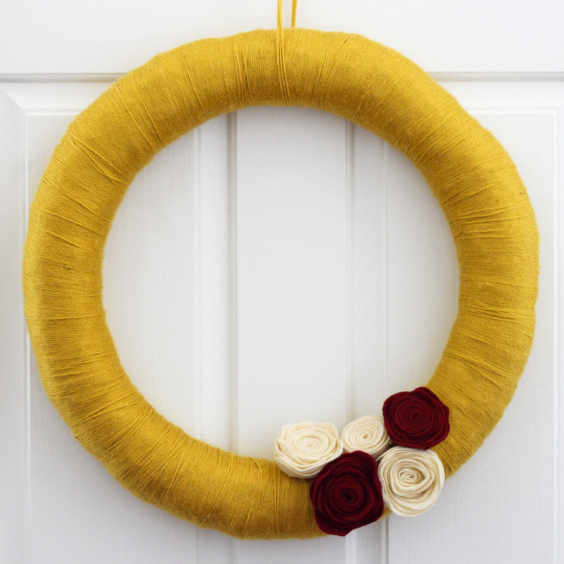 Fall yarn wreath with felt flowers. Calm Cradle Photo & Design
