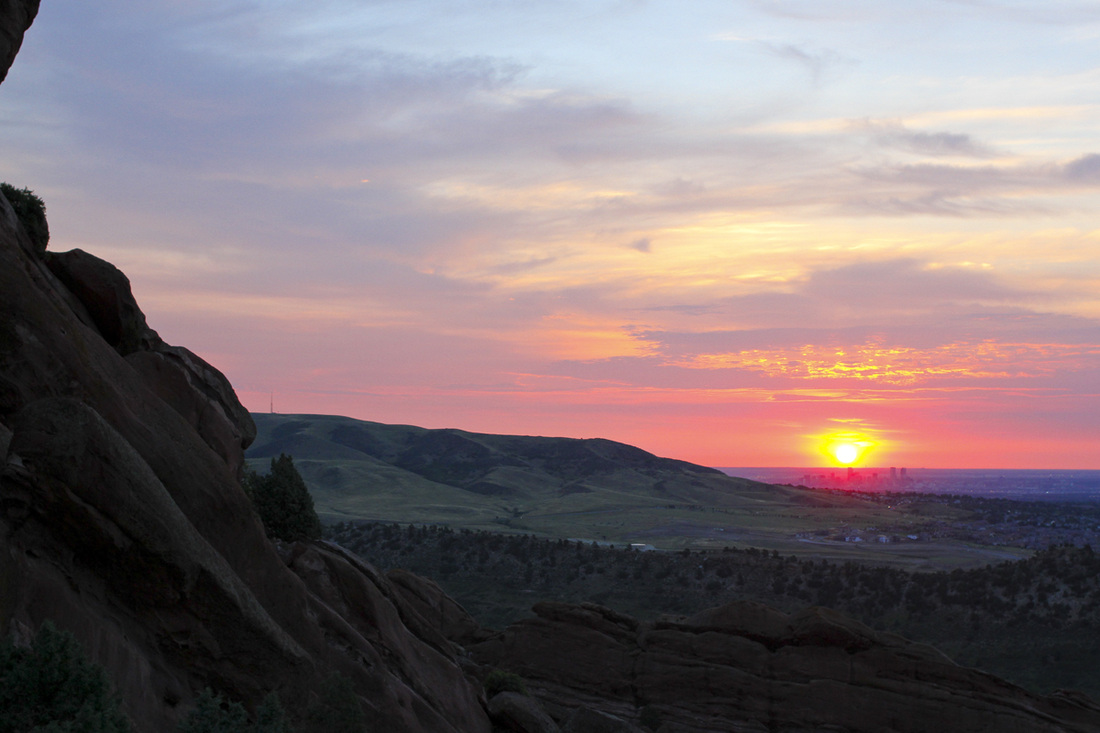 Sunrise over Denver and the Great Plains from Red Rocks Amphitheatre. Denver, Colorado. Photography by Calm Cradle Photo & Design