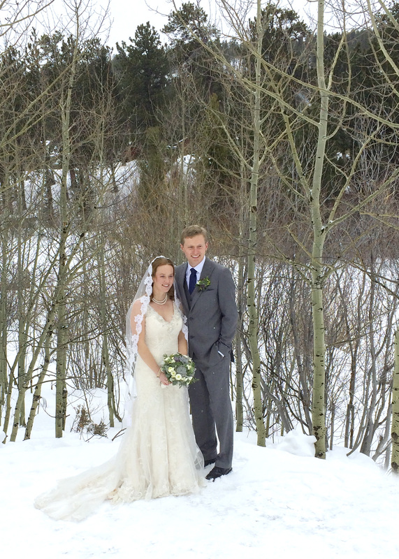 The bride and groom at Wild Basin Lodge in Allenspark, Colorado. By Calm Cradle Photo & Design