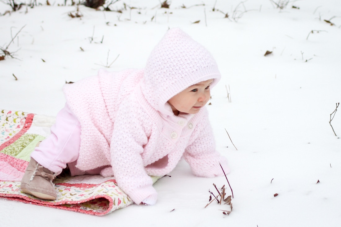 Lifestyle portraits: Baby's first snow at 9 months. By Calm Cradle Photo & Design (Chapel Hill, NC)