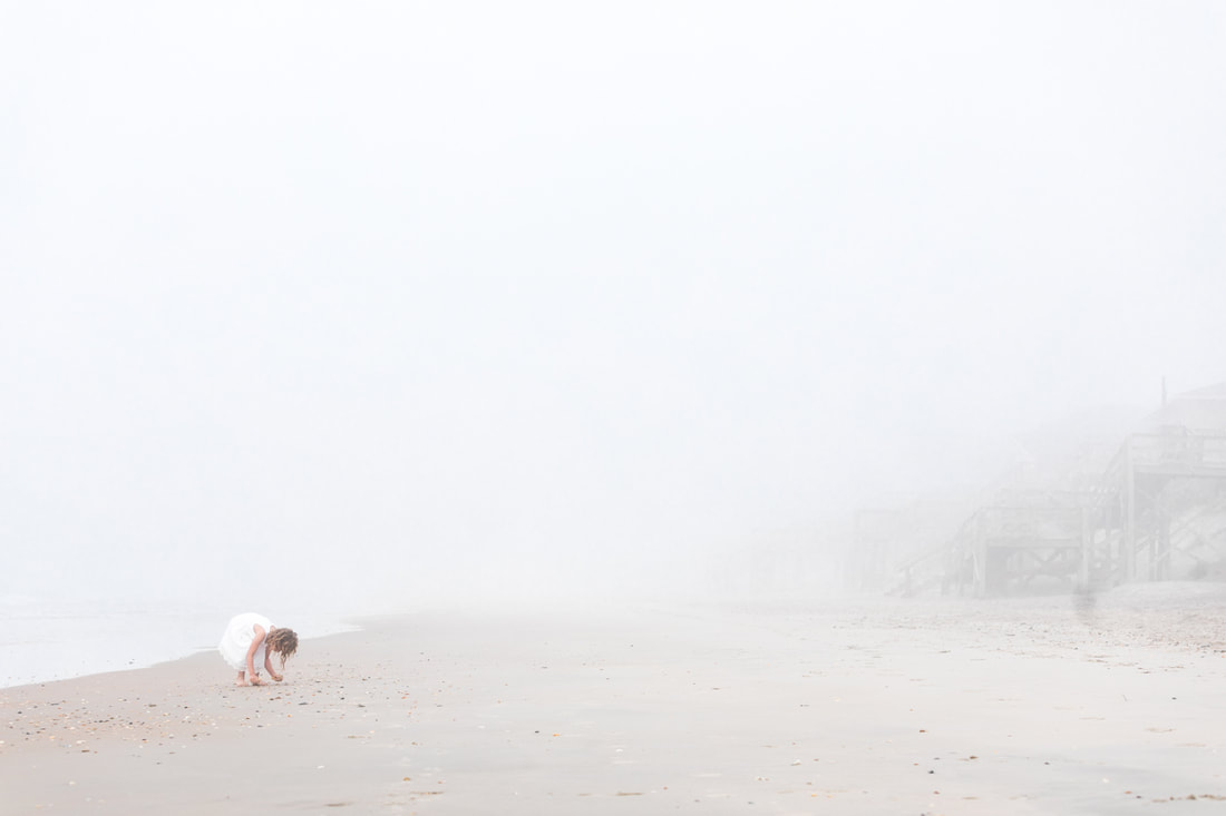 Lifestyle portraits: Turning 6 on a foggy beach (Topsail Island, NC). By Calm Cradle Photo & Design (Chapel Hill, NC) Little girl collecting shells.