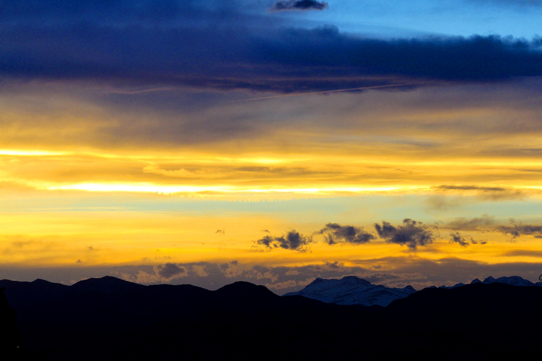 Sunset over the Front Range of the Rocky Mountains from Denver, Colorado. Calm Cradle Photo & Design