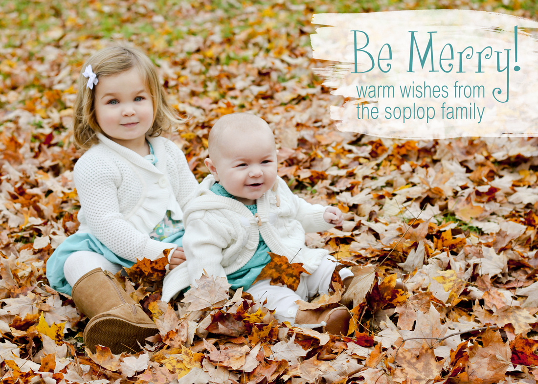 Be Merry! Girls in turquoise sitting in orange leaves. Calm Cradle Photo & Design