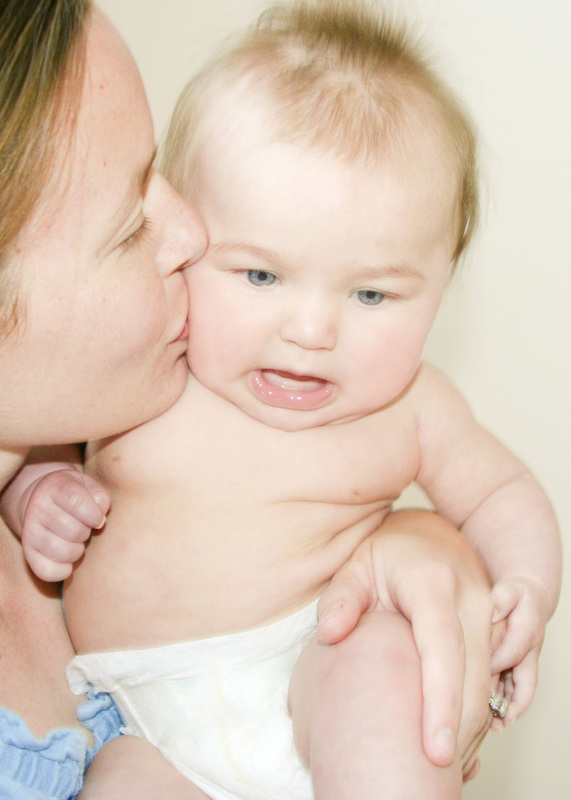 Portraits: Mom kissing 4-month-old baby. By Calm Cradle Photo & Design