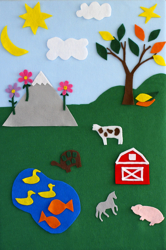 Felt board with mountain, tree, sun, moon, pond and barn. By Calm Cradle Photo & Design