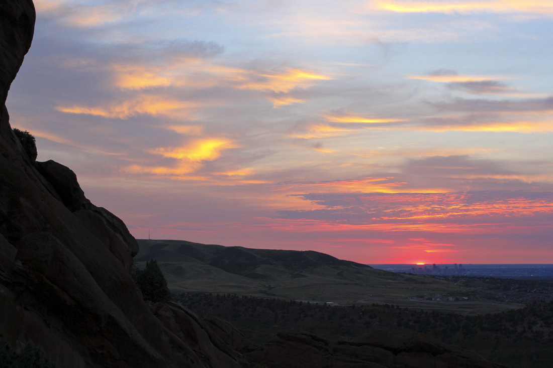 Sunrise over Denver and the Great Plains from Red Rocks Amphitheatre. Denver, Colorado. Photography by Calm Cradle Photo & Design