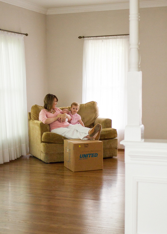 Newborn portraits: Baby in her new, empty house. Photography by Calm Cradle Photo & Design