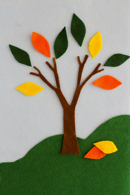 Felt board with brown tree and green, orange and yellow leaves. By Calm Cradle Photo & Design