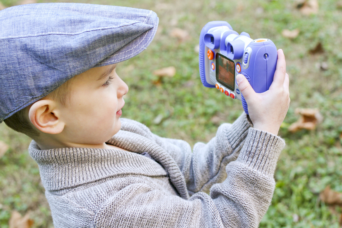 Lifestyle portrait session: Little boy with a camera. By Calm Cradle Photo & Design