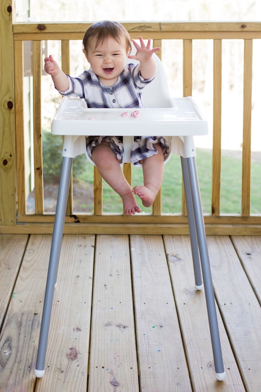 Lifestyle portraits: 10-month-old baby eating in the highchair. By Calm Cradle Photo & Design (Chapel Hill, NC)