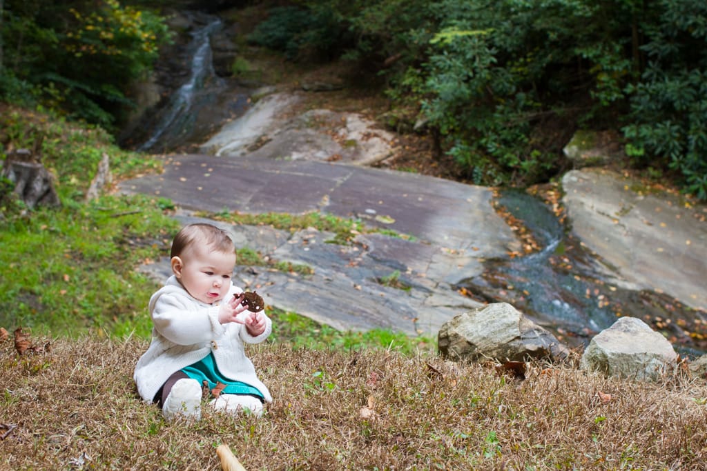 Lifestyle portraits in the Blue Ridge Mountains: Waterfall sitting at 6 months old. Blowing Rock, NC. By Calm Cradle Photo & Design (Chapel Hill, NC)