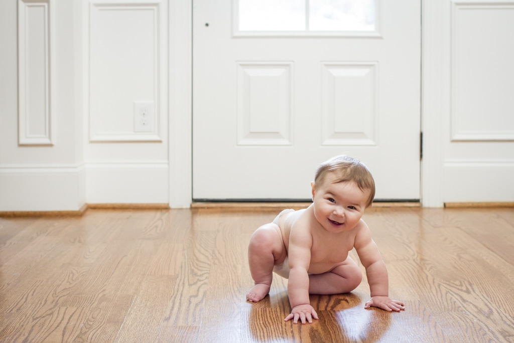 Lifestyle portraits: 7-month-old baby crawling on wood floors. By Calm Cradle Photo & Design (Chapel Hill, NC)