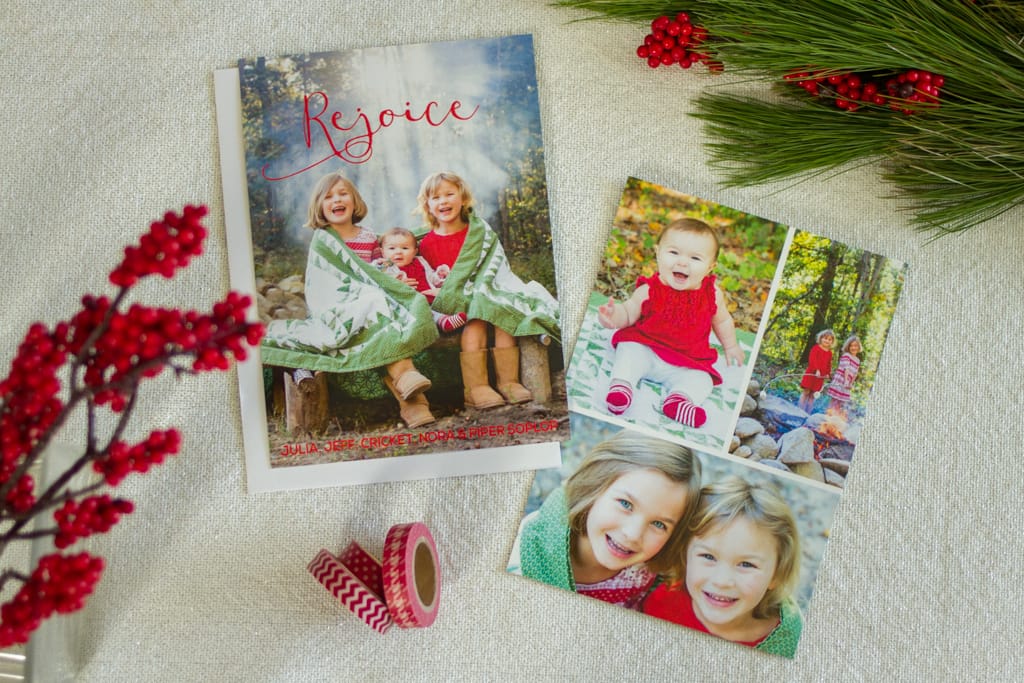 Look at the sun filter through the campfire smoke! Holiday card photos around the fire pit, wrapped in a quilt. Traditional red and green. Photography and graphic design by Calm Cradle Photo & Design. Chapel Hill, NC.